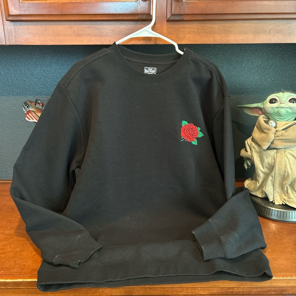 Stylish Black Crewneck Sweater with Red Rose